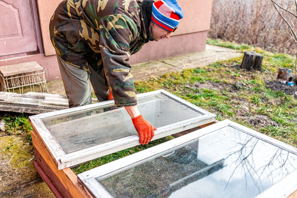 Man building a cold frame