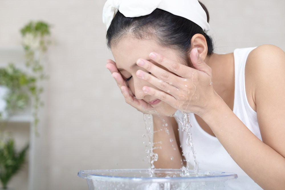 Woman washing face